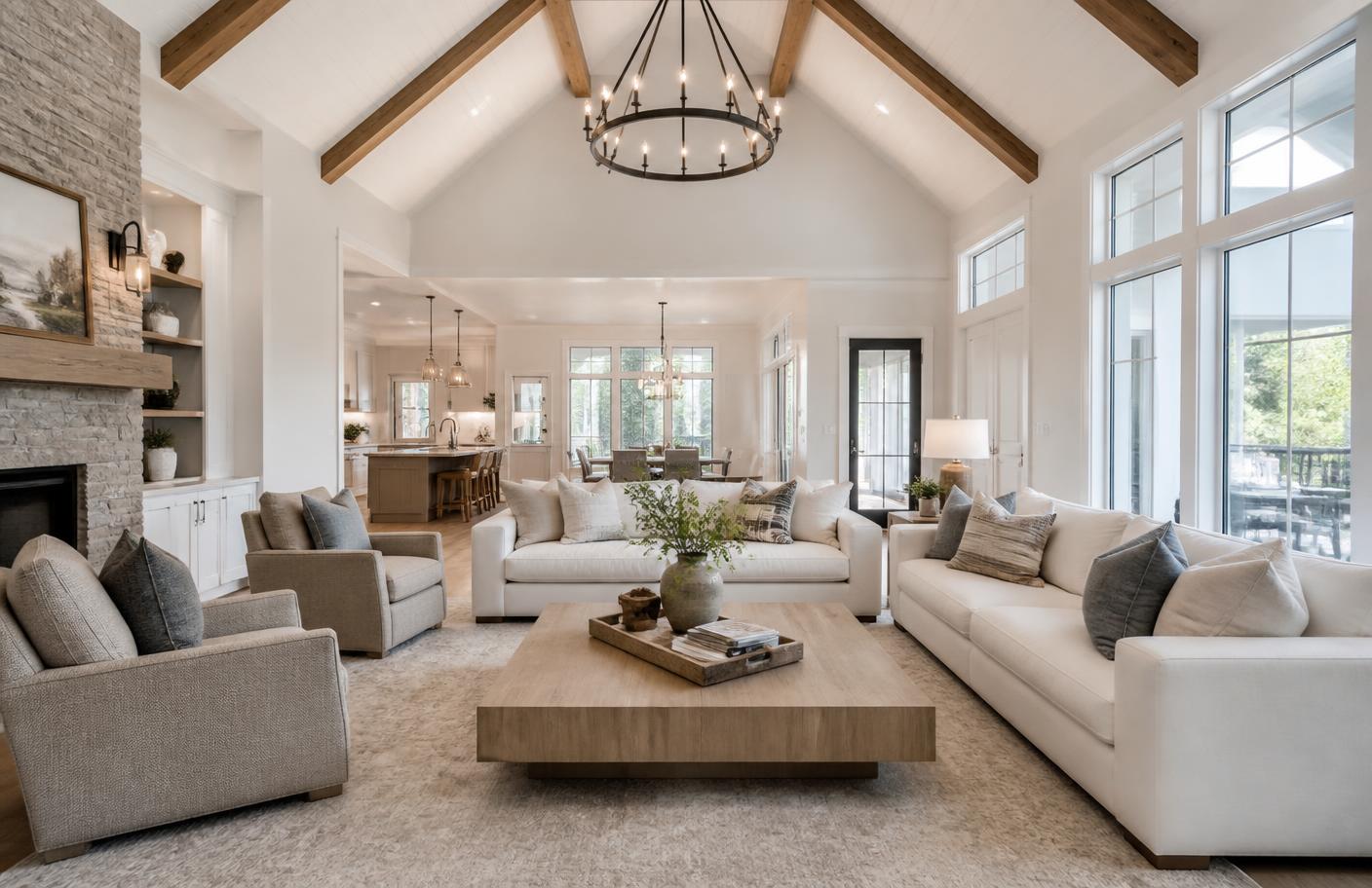 Open-concept living room with vaulted ceiling and wood beams
